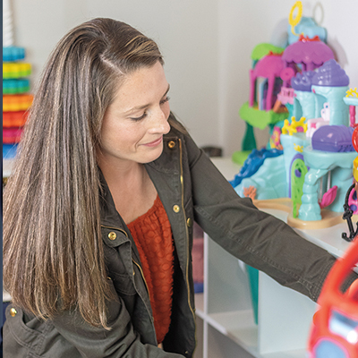 woman-putting-book-away